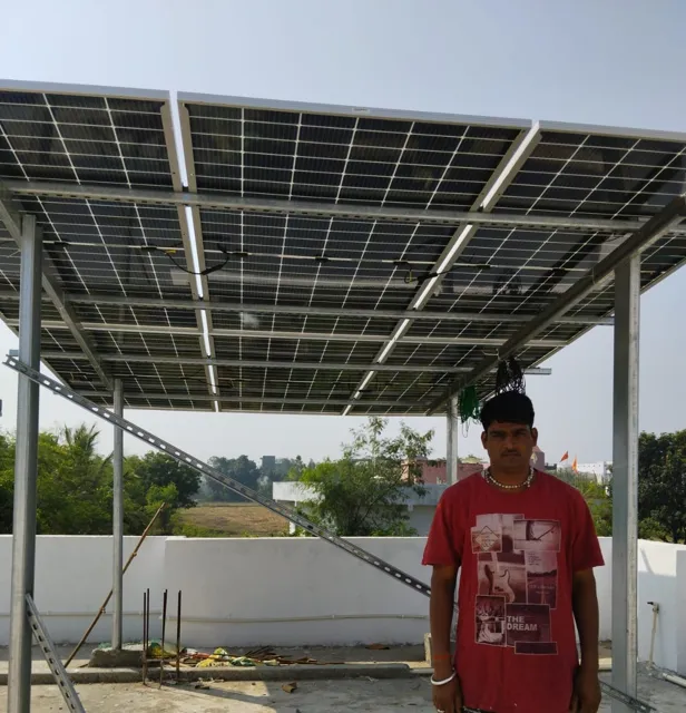 Dinesh Kumar Garg with the 5 kW rooftop system