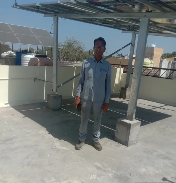 Shri Jugal Kishore Saini with the 4 kW rooftop system