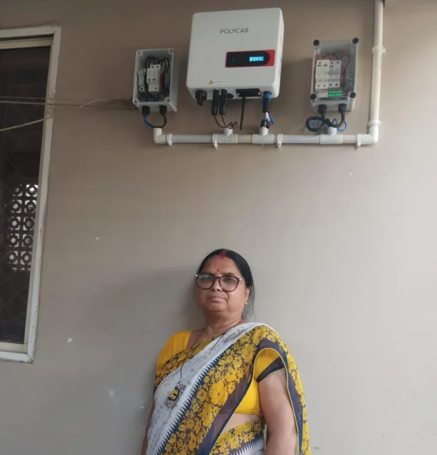 Smt Sushma A K Saroj with the 3 kW rooftop system